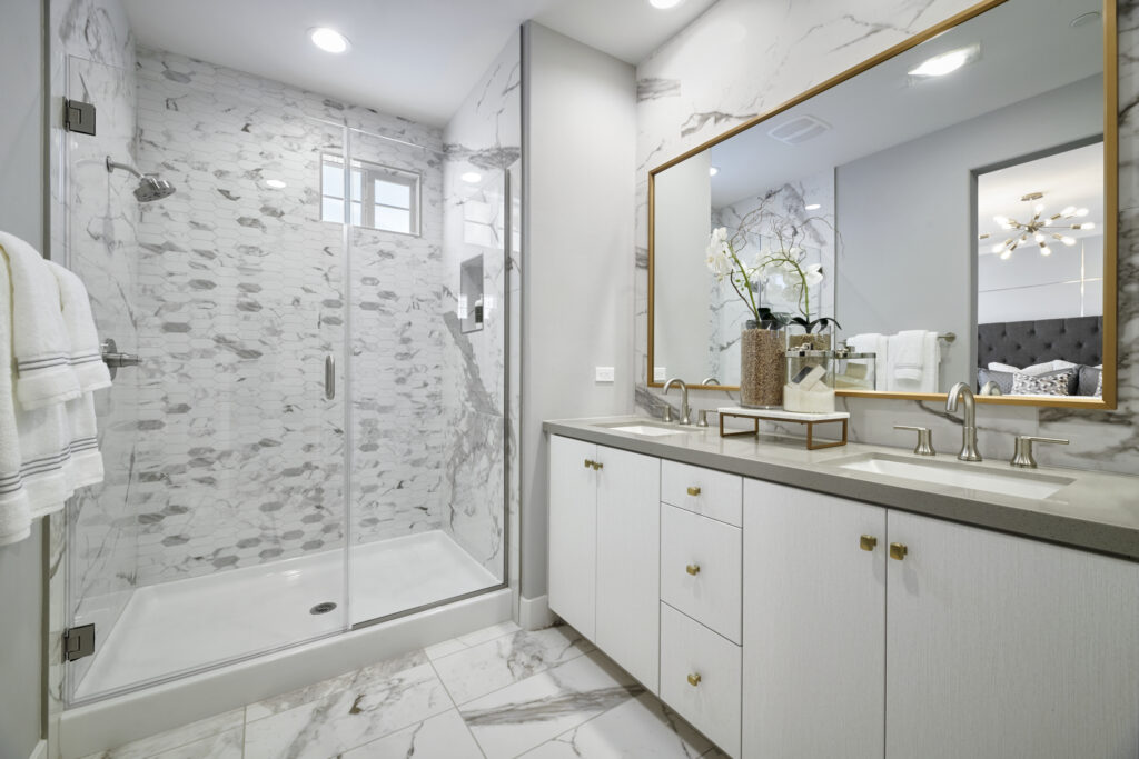 The master bathroom at Rancho Soleo features different types of luxurious marble bath tile.