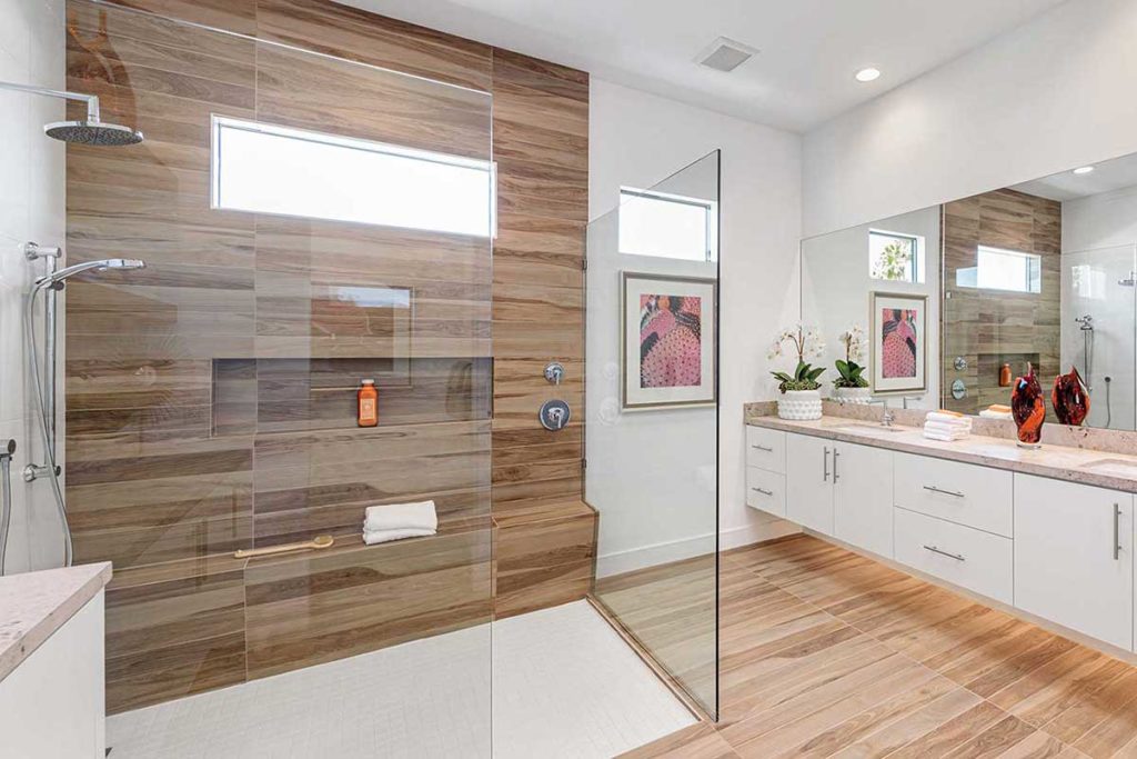 Master bathroom in Palm Springs, California. Modern and clean lines with wood-look tile, interior design by Design Tec.